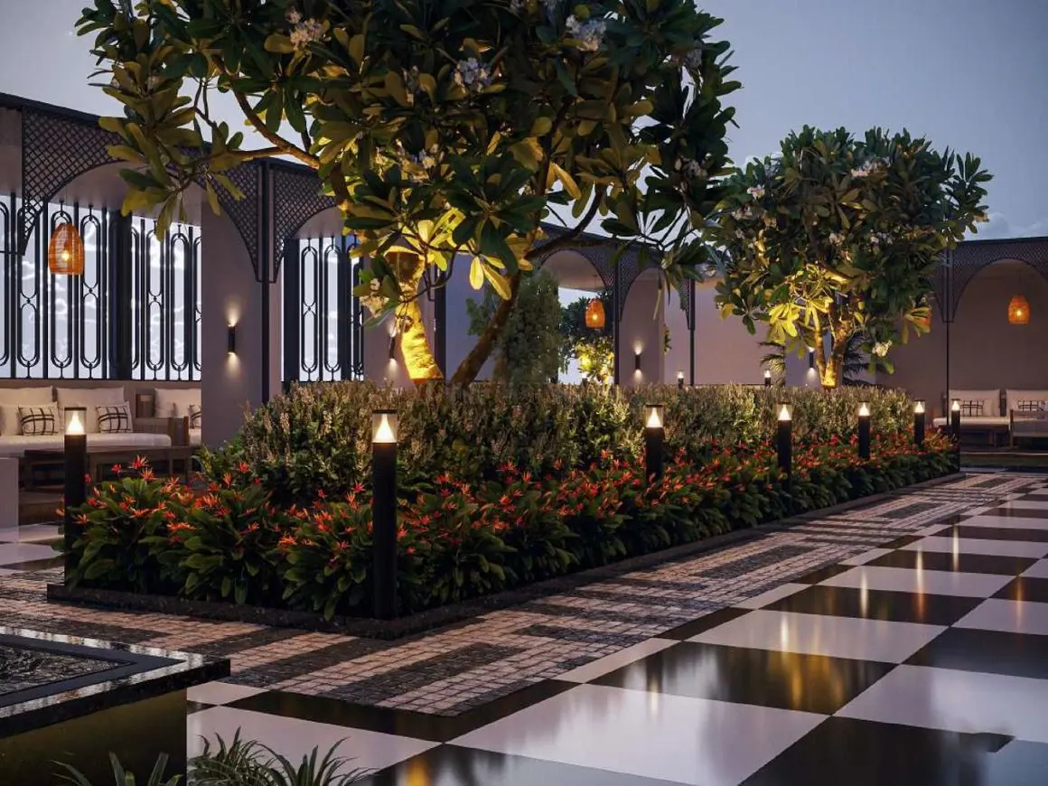 Landscaped garden path lit in the evening — Aerovista, Jaipur